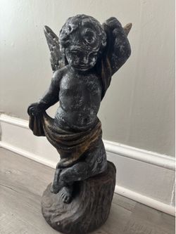 Solid concrete cherub