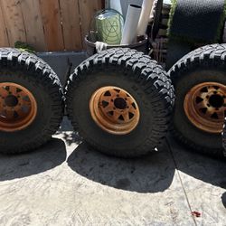 M/T 35x12.5x15 Tires and 6 Lug 8 Spoke Wheels 