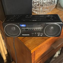 Vintage Panasonic ATS (AudioTime Series) model RC-X210 AM/FM stereo digital clock radio in black.  Features: - Dual speaker stereo sound with "Ambienc