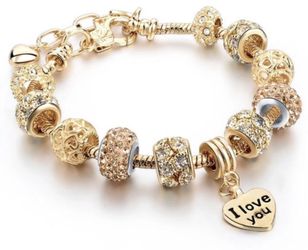 New 18 k yellow gold pandora style bracelet with charms