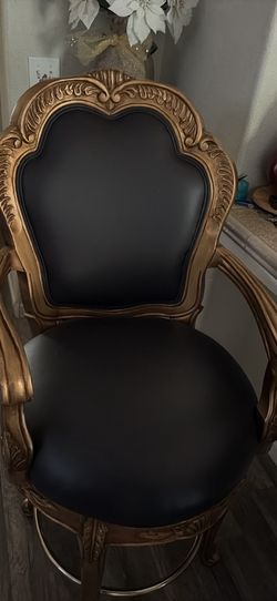 Black/golden swivel chairs