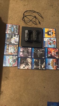 PS4 slim plus two controllers and 15 games