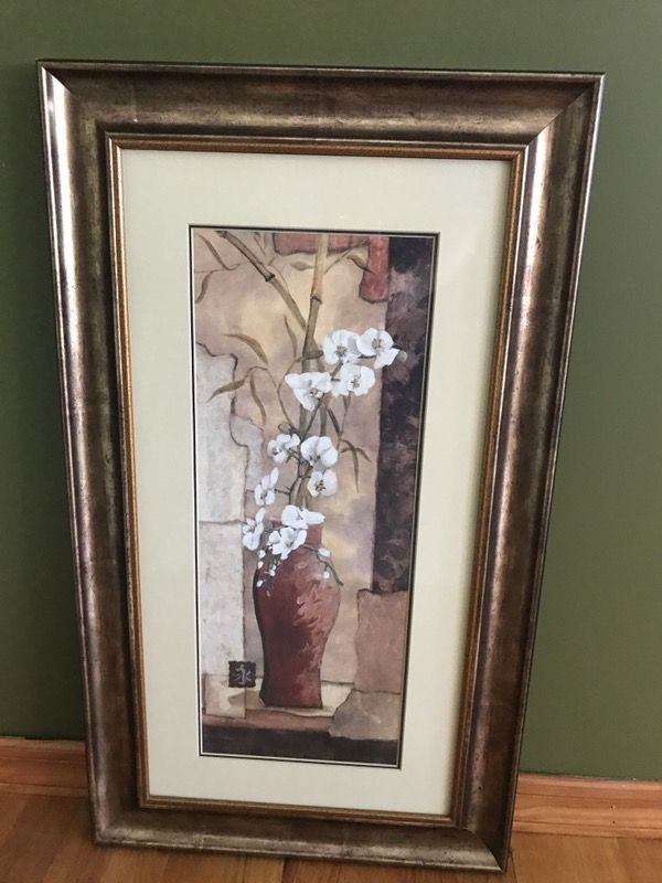 White flower in red vase painting in brown wooden frame