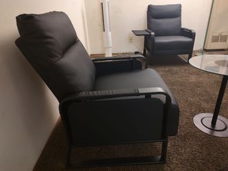 Two Black Leather Chairs