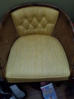 Nice vintage rattan gold chair on rollers