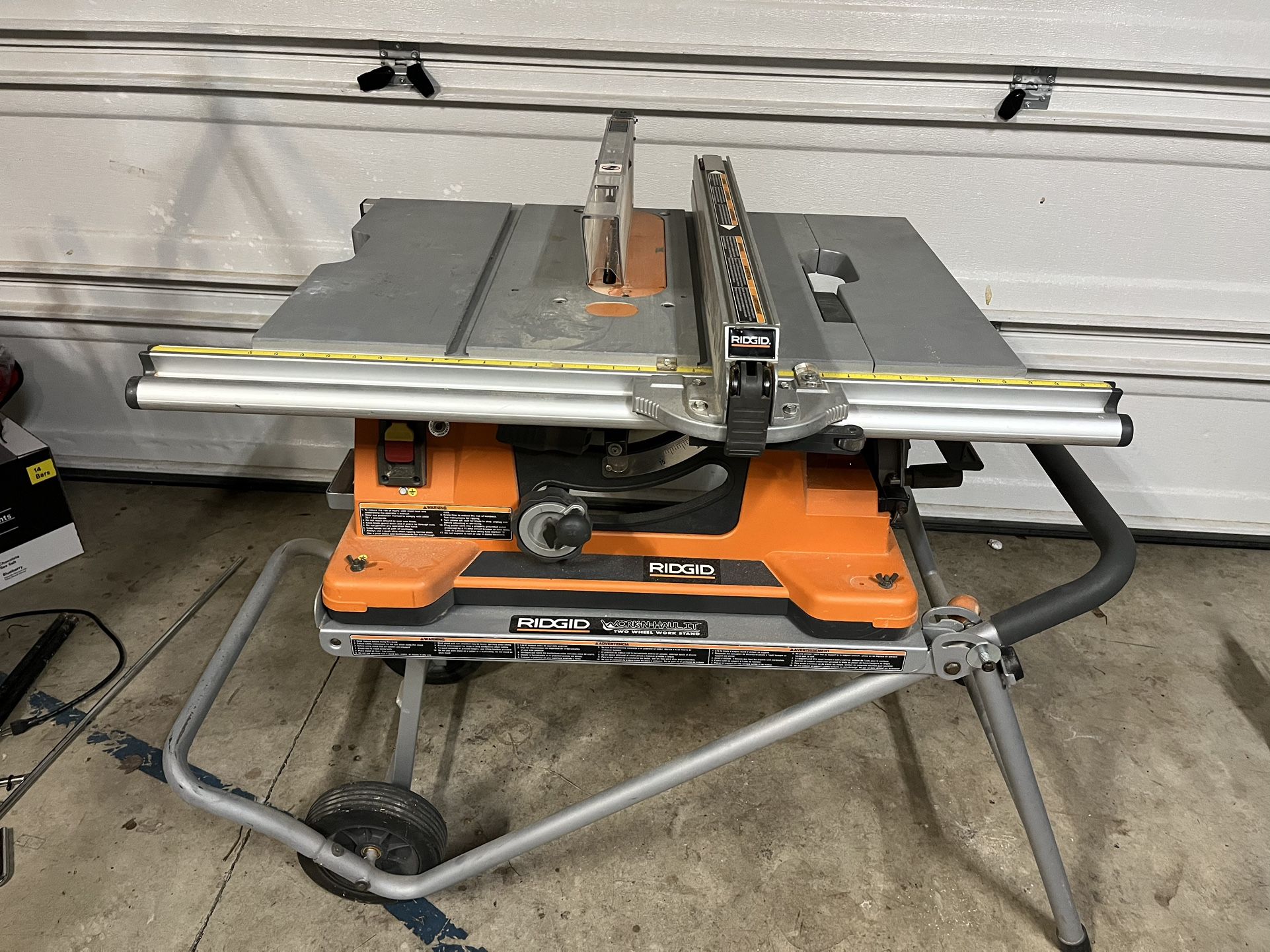 Rigid Table Saw With Work Haul 2 Wheel Stand
