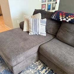 Ashley furniture three-piece sectional with Chaise (Grey)