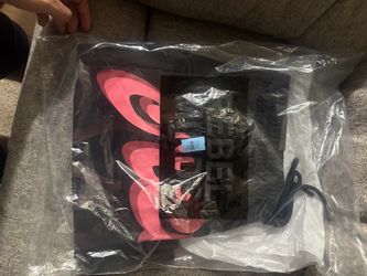 The Word on the front of shorts  say cream, black and pink medium rebel shorts