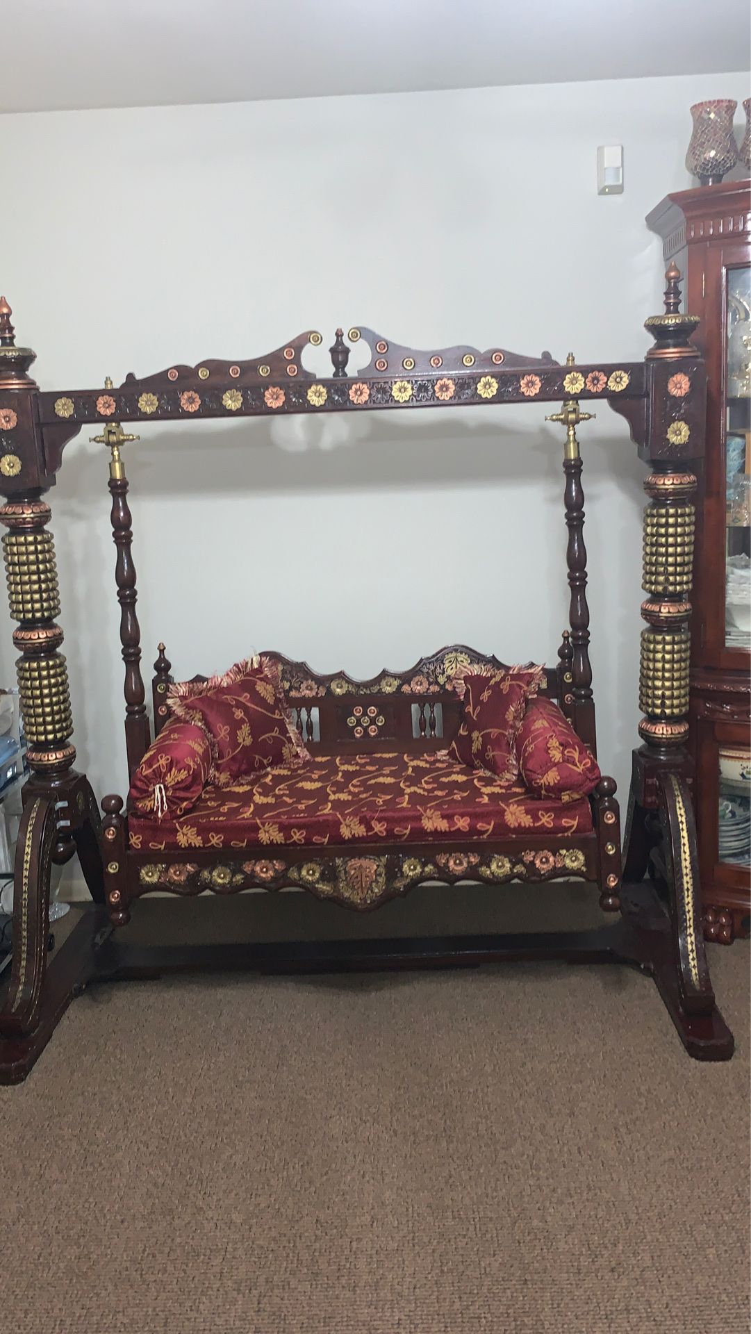 Selling my desi style wooden indoor swing very beautiful comes with extra pillows smoke free home