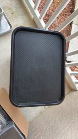 commercial-grade black plastic fast food and cafeteria trays featuring a textured basketweave surface.