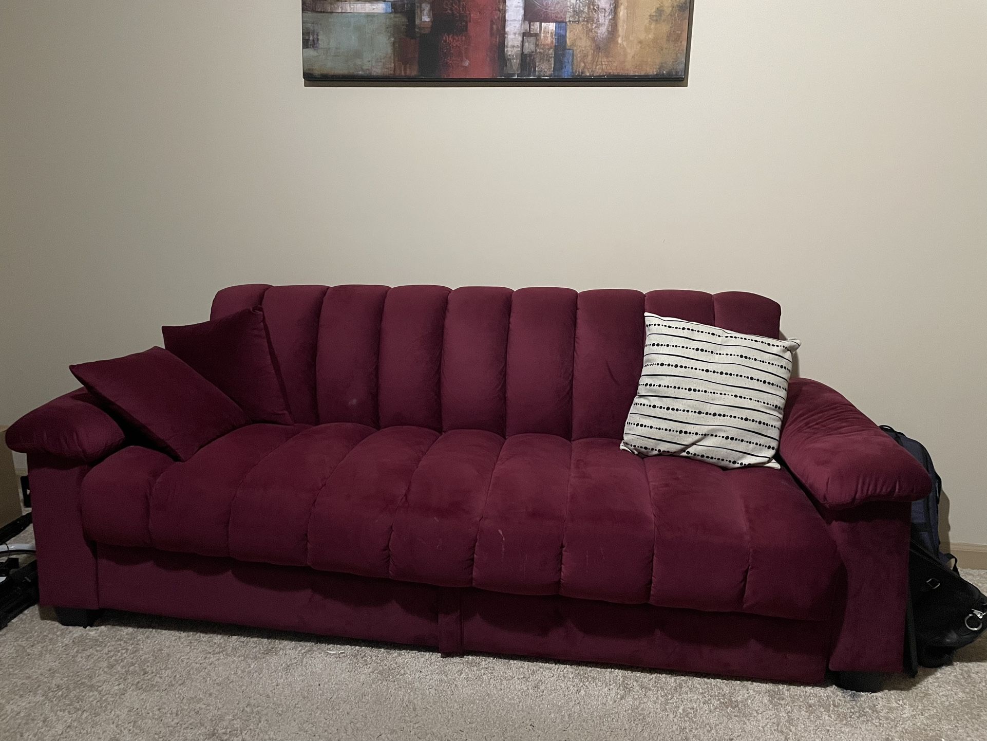 Burgundy futon and Two Pillows