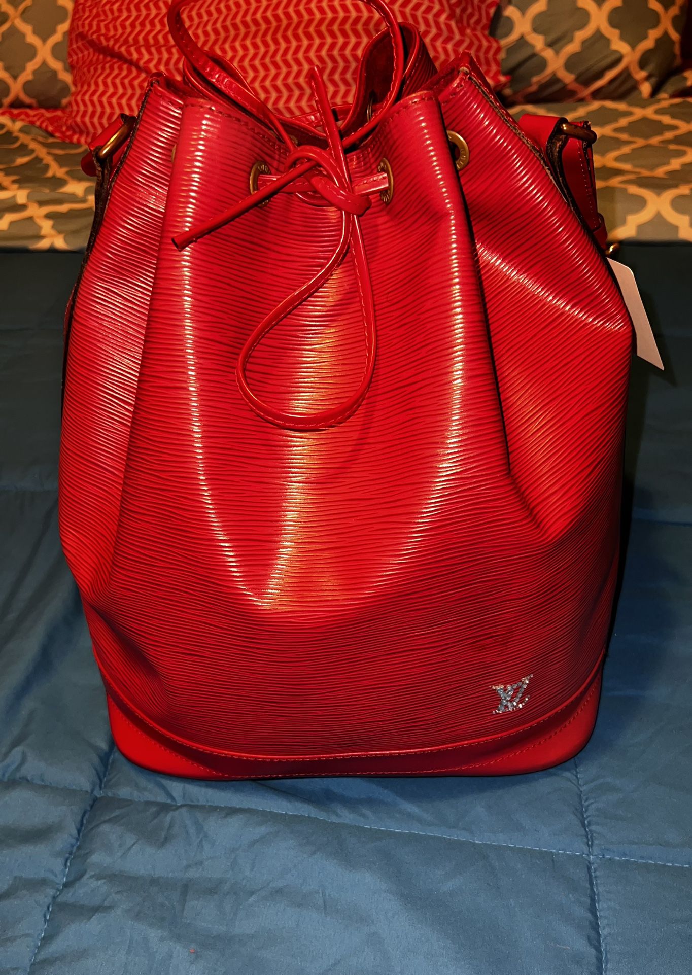 Beautiful Vibrant Red Louis Vuitton Epi Noé customized with rhinestone’s