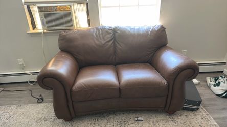 Leather love seat and couch with new recliner for sale
