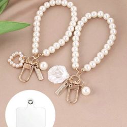 Simple pearl phone strap with shell heart pendant. Stylish, lightweight, and great for gifts.