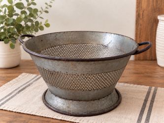 Vintage large metal colander with pedestal base and side handles