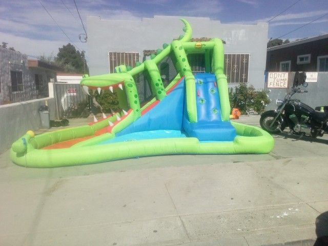 Swimming Pool With Slide Connects To Water Hose