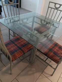 Perfect little glass top table with 4 chairs