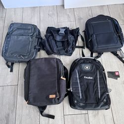 There are several black backpacks, including an OGIO brand model with the "stadion" logo printed on it. 
