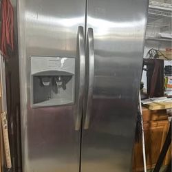 Frigidaire stainless steel 25.5 cu. ft. Side by side refrigerator  Height 69 3-5”, width 36”