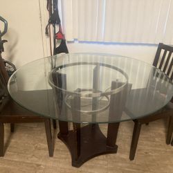 Kitchen Glass Table 48 In Diameter  With 3 Wooden Chairs Moving Need It Picked Up Before July8 2025