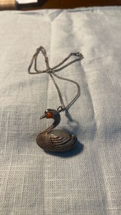 Vintage Sterling silver filigree swan pendant with its chain white stone belly and red stones eyes
