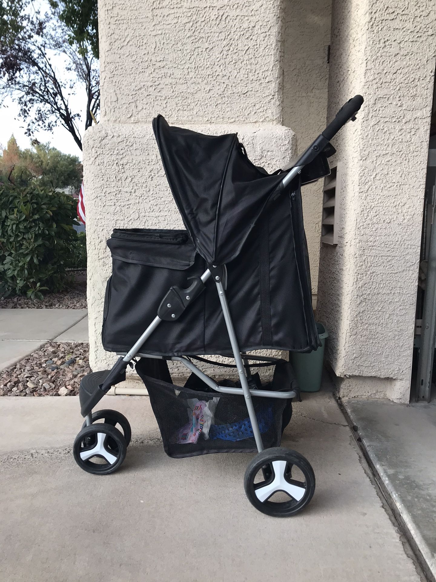 Dog stroller. Perfect for small to medium size dog. My dog weighs 17lbs and there is still plenty of room. Bottom compartment is large enough for pu