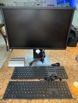 Dell 22" Monitor / laptop Stand / 2 keyboards one Dell n the other a HP