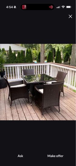 Glass table 4’ x 6’ with wicker base