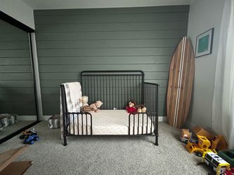 Toddler bed with crib conversion