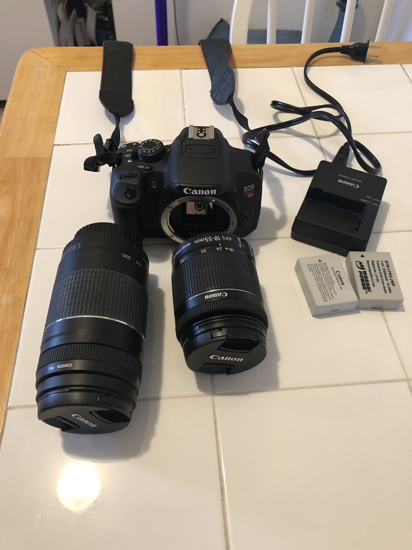 Canon T5 with two lenses (18-55mm and 75-300mm)