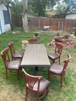 Dinette set, 27"X5' table with 6 shafer. chairs