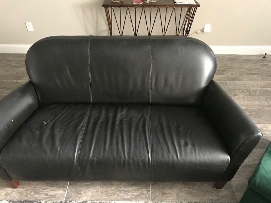 Black leather love seat