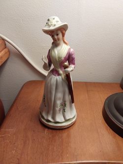 Cute porcelain statue of a Fancy Lady