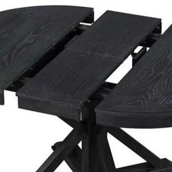 Gorgeous wood Dining table with 4 chairs, round to oval when extended.