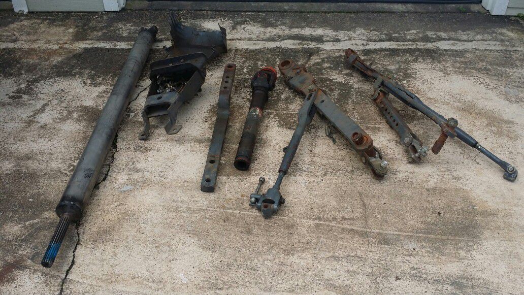 Tractor lift arms, draw bar, mount, mower blades.