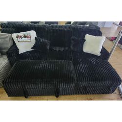 Black jumbo corduroy sectional sleeper sofa with pull out bed