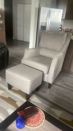 Fabric upholstered chair with ottoman. Gently used in great condition