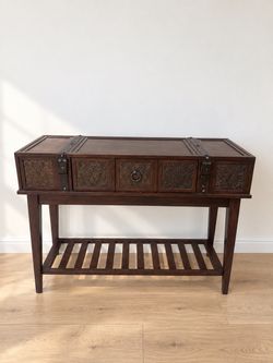 Dark Wood Console Table with Carved Panels