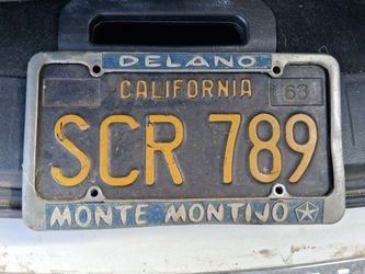 VINTAGE 1963 CALIFORNIA LICENSE PLATE w/ ORIGINAL FRAME from MONTE MONTIJO CHRYSLER PLYMOUTH in DELANO, CA.. GREAT DELANO HISTORY!...asking $60.00