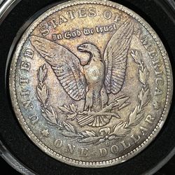 1886 O Toned Morgan Silver Dollar