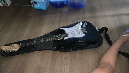 Zeny Bluish Blackish Guitar With A Mini Amp