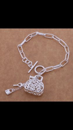 Sterling silver stamped 925 charm bracelet