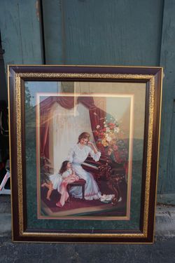 Lady and child besides piano
