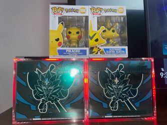 Twilight Masquerade Elite Trainer Boxes 240$ for both comes with glass cases and two free pop Pokémon’s .