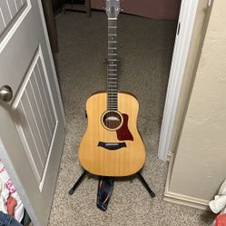 Taylor Acoustic Guitar With Soft Case And Stand