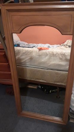 Nice heavy mirror with strap to hang..very old