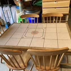 Kitchen Table With Mosaic Tiles And Six Chairs