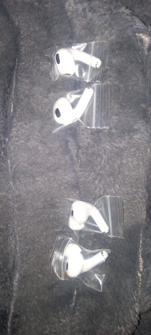 NEW NEVER USED AIR-PODS EAR BUDS... ( 2 SEPARATE COMPLETE SETS  MINUS CHARGE CASES )