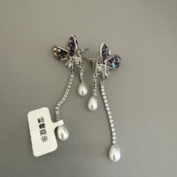 Women’s purple bow knot with pearl earrings