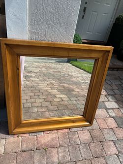 thick-framed, square wooden decorative wall mirror $120